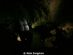 N. Florida cave diver with doubles leaving the cavern zon... by Nate Ewigman 